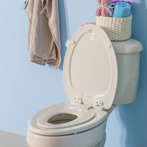 Asiento para sanitario NextStep® alargado color blanco de madera con adaptador infantil